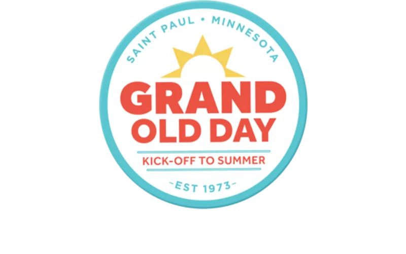 Circular logo with a sun above Grand Old Day, Kick-Off to Summer below, and outer ring reading Saint Paul, Minnesota Est 1973.