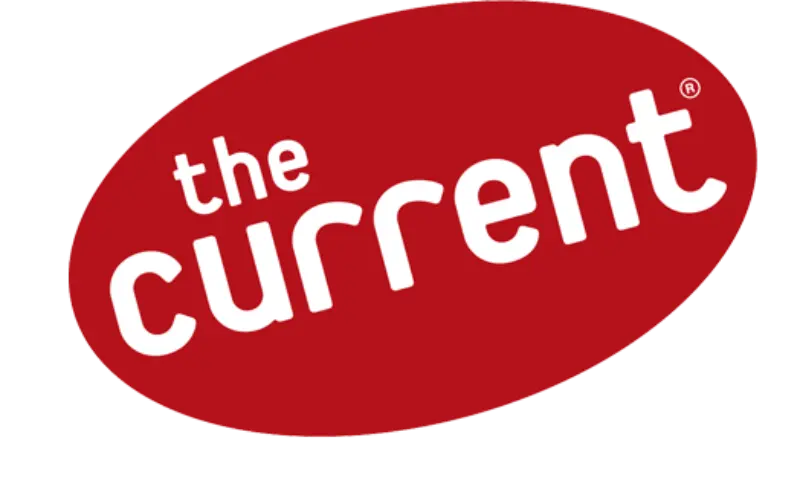 Red oval with bold, white lowercase text “the current” in rounded font, slightly right-tilted.