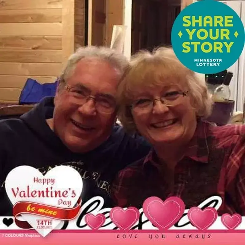 Smiling couple with glasses in a cozy setting; Share Your Story graphic, Valentines Day frame with hearts, and Love You Always text.